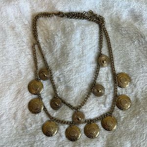 Gold necklace with coin like charms